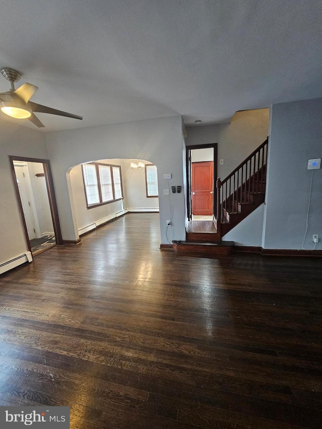 unfurnished living room with a baseboard radiator, dark wood-type flooring, and ceiling fan