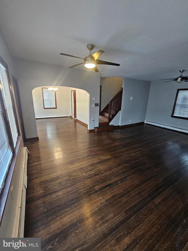 unfurnished room with ceiling fan and dark hardwood / wood-style flooring