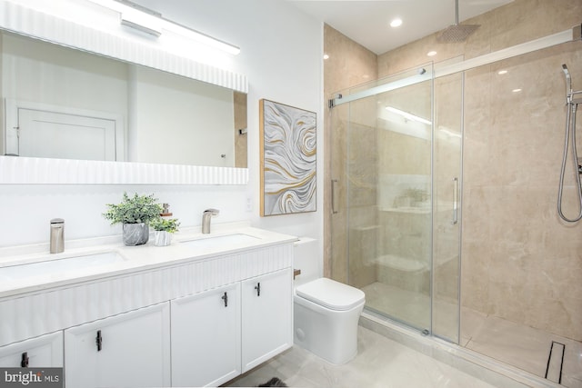 bathroom with vanity, toilet, and an enclosed shower