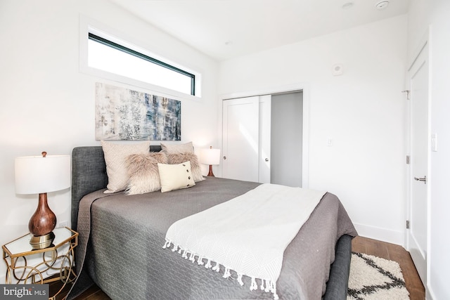 bedroom featuring a closet and hardwood / wood-style flooring