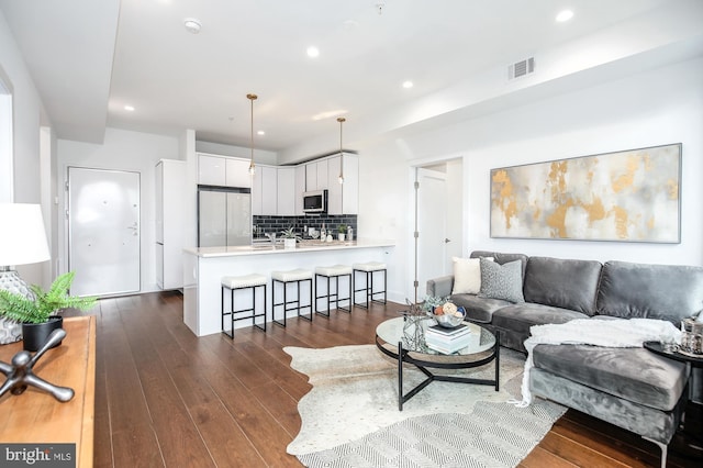 living room featuring dark hardwood / wood-style floors