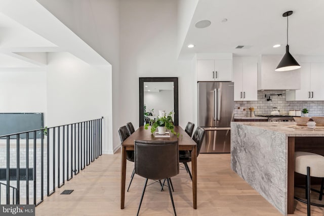 dining room with light wood-type flooring