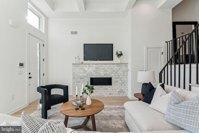 living room featuring a fireplace and light hardwood / wood-style floors