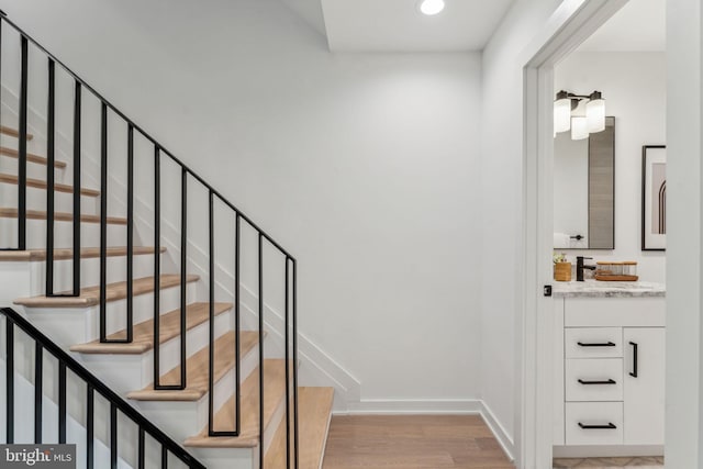 stairs with wood-type flooring