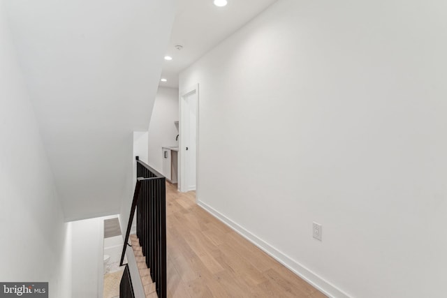 hall with light hardwood / wood-style flooring