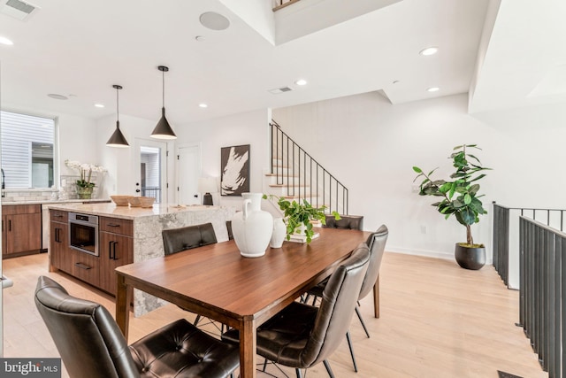 dining room with light hardwood / wood-style floors