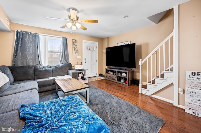 living room with hardwood / wood-style flooring and ceiling fan