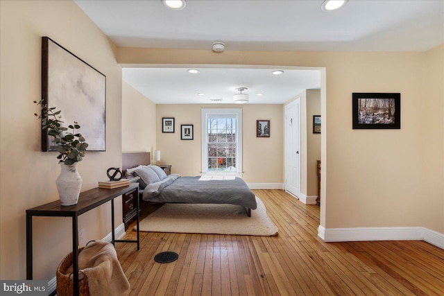 bedroom featuring recessed lighting, baseboards, and hardwood / wood-style flooring