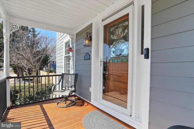 wooden terrace featuring a porch