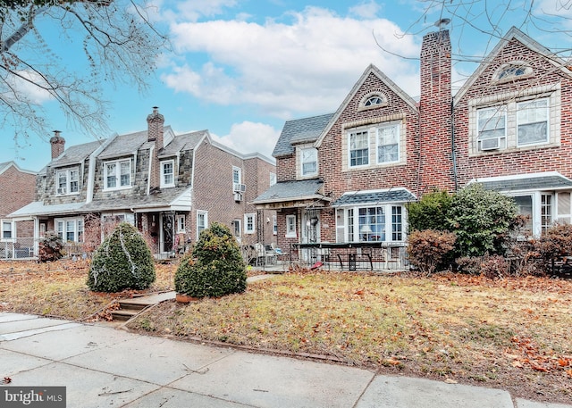 view of front of house with brick siding and a residential view