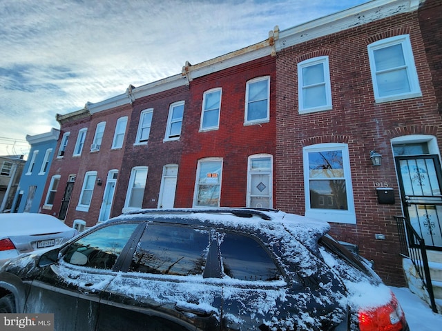 view of snow covered property