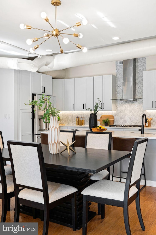 dining space with light wood-type flooring