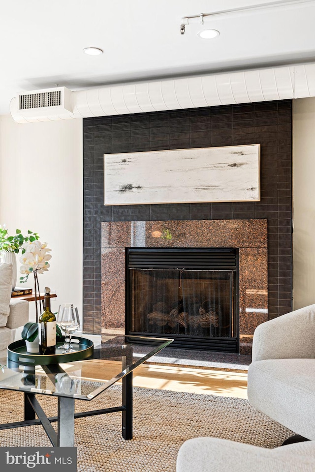 room details featuring a tile fireplace