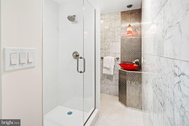 bathroom with walk in shower and tile walls