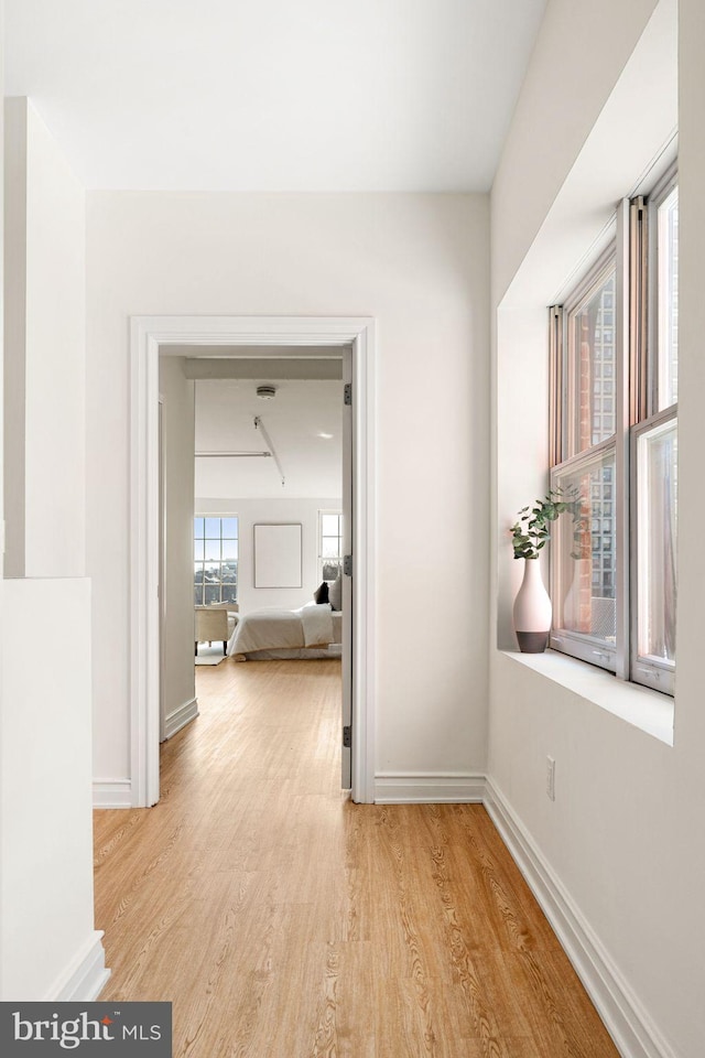 hallway featuring light hardwood / wood-style flooring