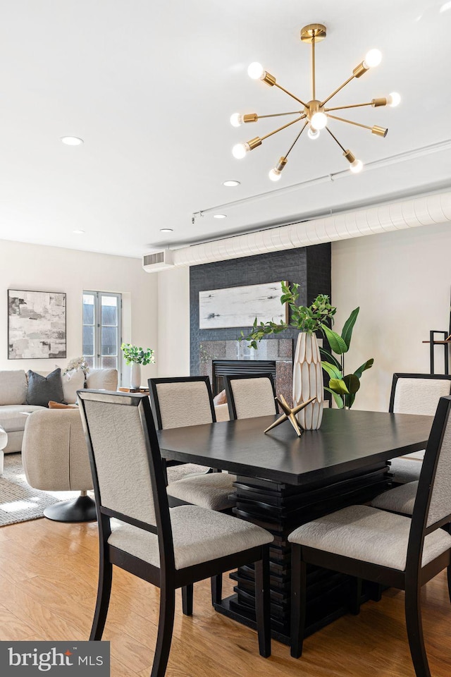 dining space featuring light wood-type flooring