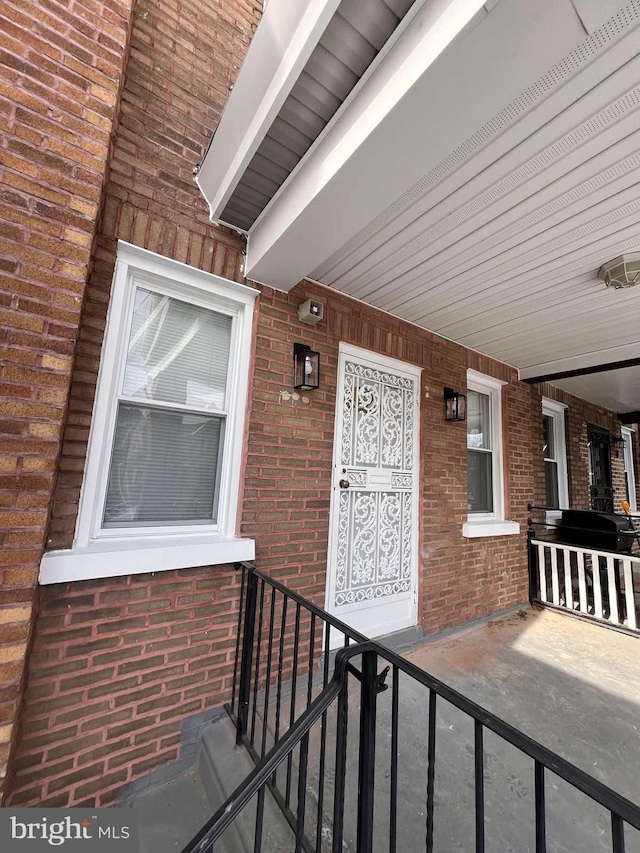 doorway to property featuring covered porch