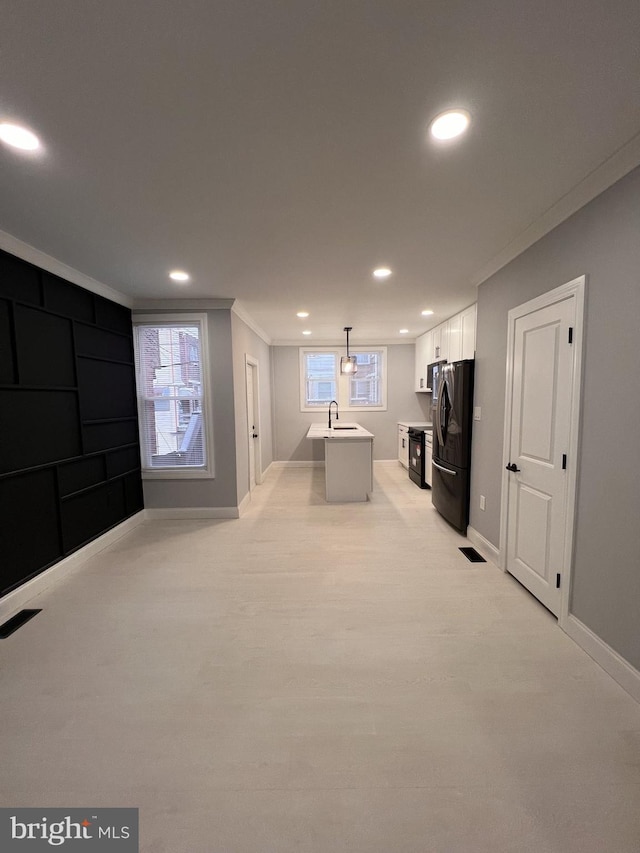 rec room featuring crown molding and sink