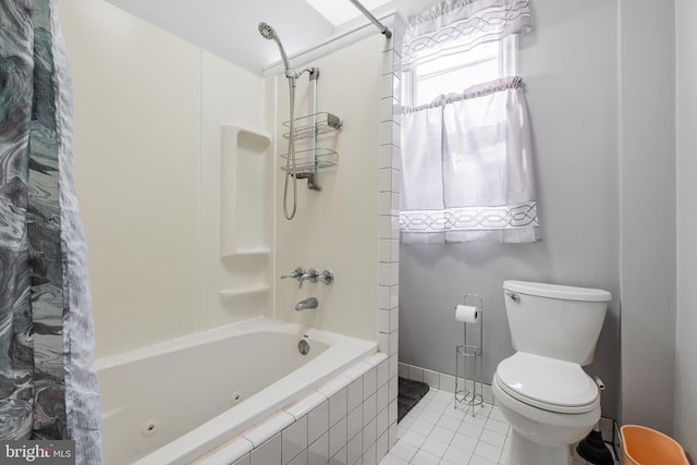 bathroom featuring shower / bath combination with curtain, toilet, and tile patterned flooring