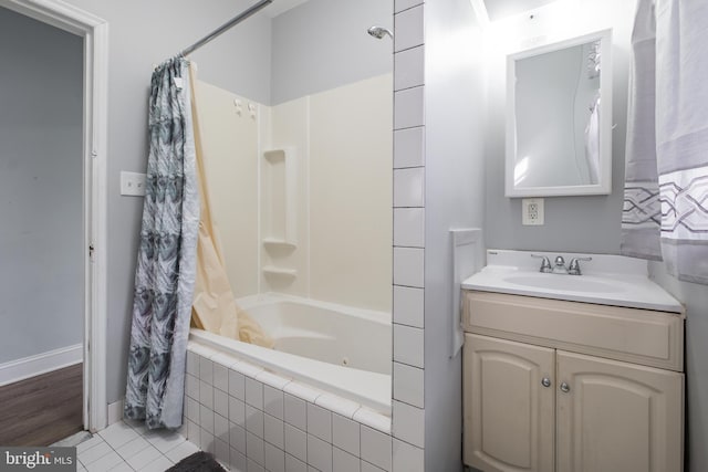 bathroom featuring tile patterned floors, shower / tub combo, and vanity