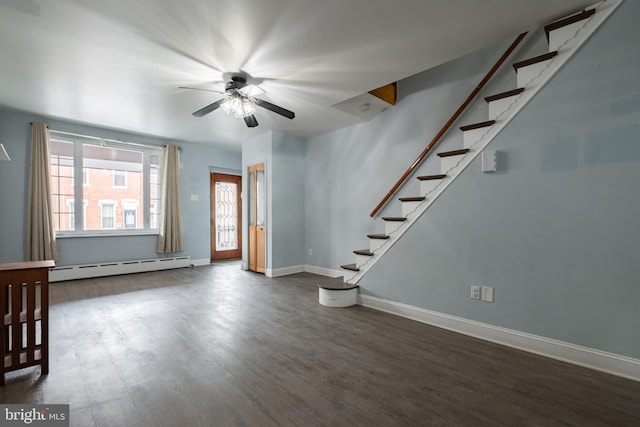 unfurnished living room featuring ceiling fan, a baseboard heating unit, and dark hardwood / wood-style flooring