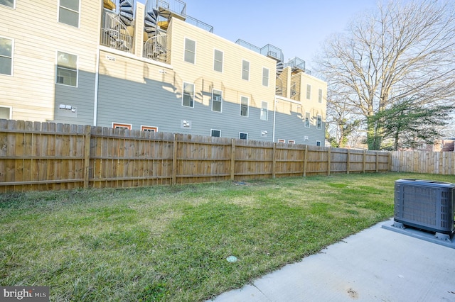 view of yard featuring central air condition unit