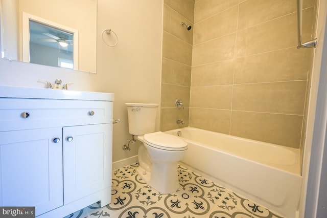 full bathroom featuring toilet, tiled shower / bath combo, tile patterned floors, and vanity