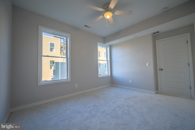 carpeted empty room with ceiling fan