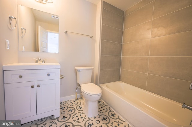 full bathroom featuring toilet, vanity, tiled shower / bath combo, and tile patterned flooring