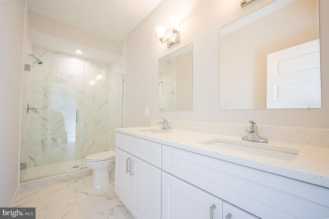 bathroom with an enclosed shower, vanity, and toilet