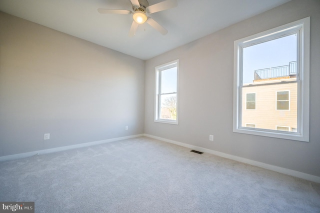 carpeted empty room with ceiling fan