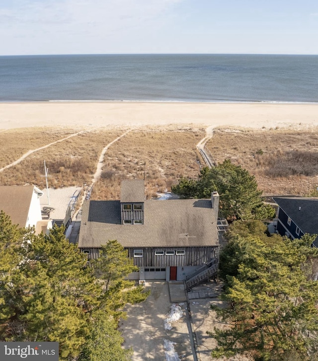 bird's eye view featuring a view of the beach and a water view