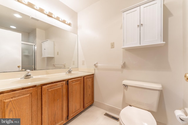 full bath featuring double vanity, visible vents, toilet, a sink, and a shower stall