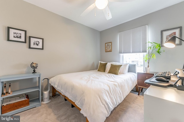 bedroom with light carpet and ceiling fan