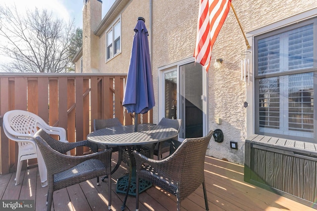 deck featuring outdoor dining area