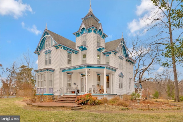 back of property with covered porch