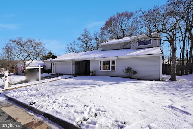 view of front of property with a garage