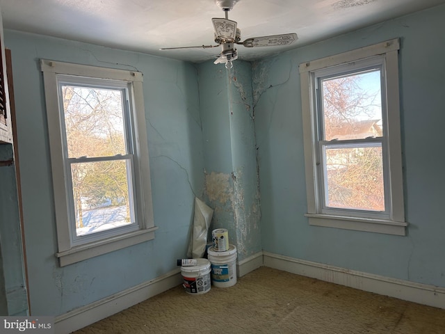 unfurnished room with ceiling fan