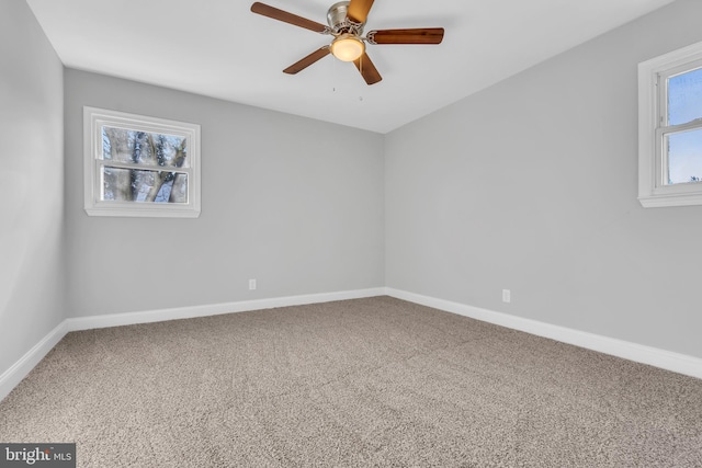 carpeted empty room featuring ceiling fan