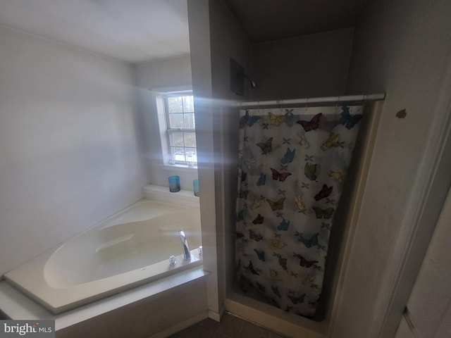 bathroom with separate shower and tub