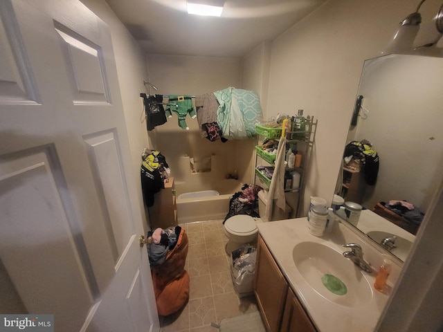 full bathroom with vanity, toilet, and  shower combination