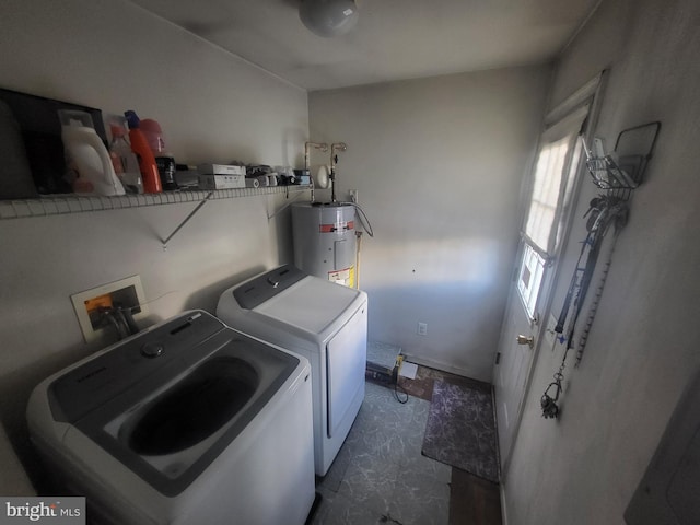 washroom featuring electric water heater and washing machine and clothes dryer