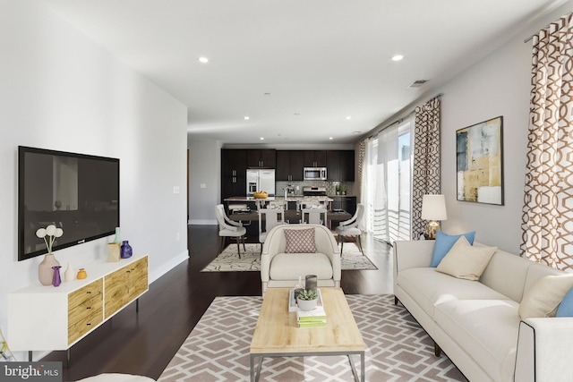 living room featuring dark hardwood / wood-style flooring