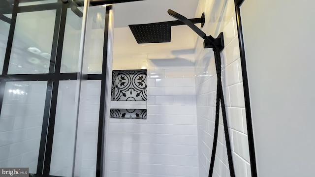 interior details with a tile shower