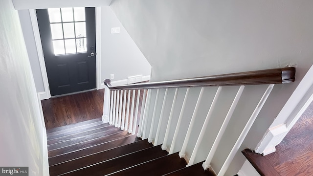 staircase featuring hardwood / wood-style floors