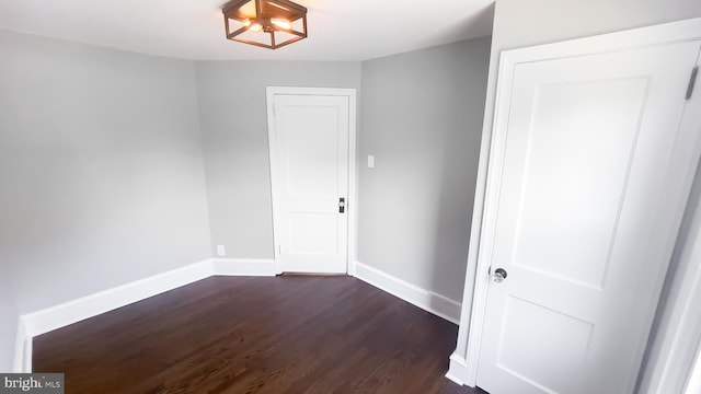 empty room featuring dark hardwood / wood-style floors