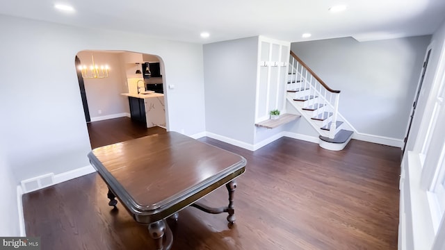 interior space featuring sink and dark hardwood / wood-style flooring