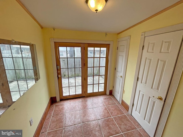 doorway with tile patterned floors and vaulted ceiling