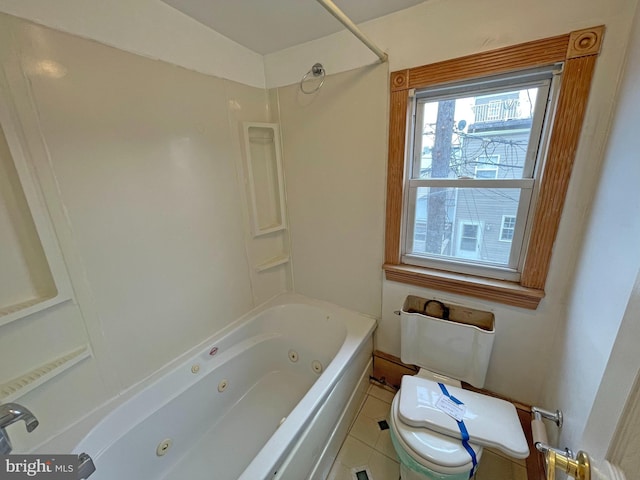 bathroom with bathtub / shower combination, toilet, and tile patterned flooring