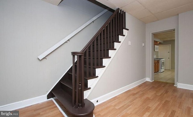 staircase featuring hardwood / wood-style flooring